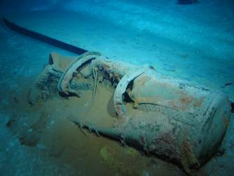 Steel plate and cylindrical tank on seabed. Top of B turret?